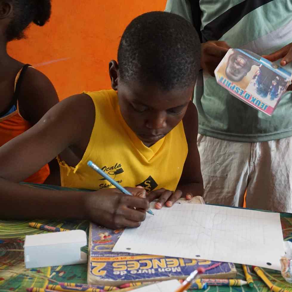 Boy drawing at table